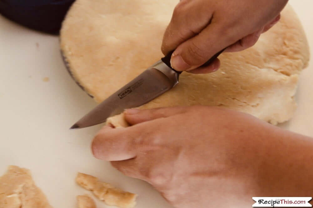 Air Fryer Apple Pie trimming the top