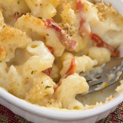 Welcome to our baked 5 cheese macaroni and cheese. This super naughty recipe featuring bacon will remind you about how amazing macaroni cheese is.