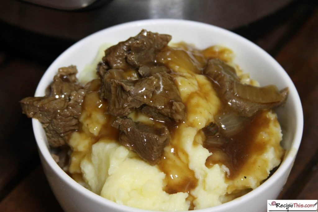 Instant Pot Beef Tips And Gravy Over Mashed Potatoes