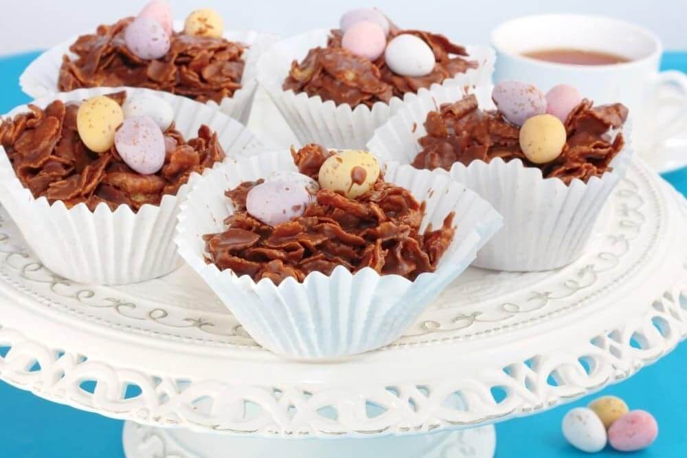 Welcome to my Instant Pot Corn Flake Easter Buns recipe. Delicious melted chocolate over little corn flake buns, covered with Caburys Mini Eggs