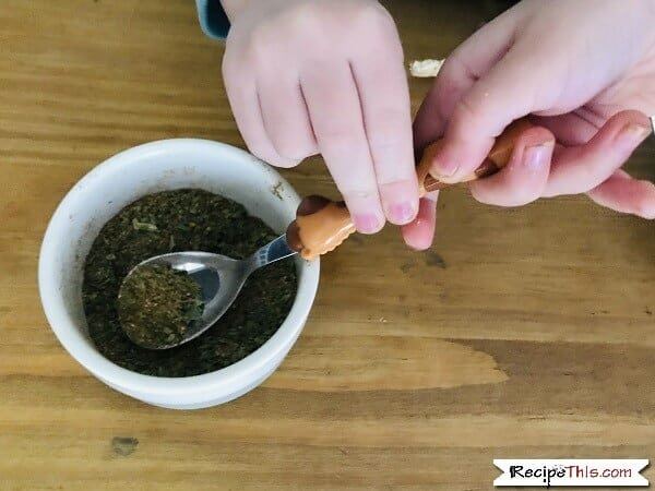 Kids mixing cuban fried rice seasoning