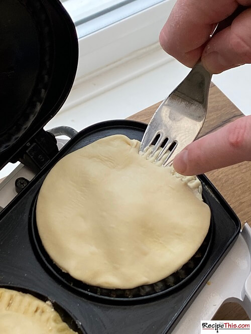 pie maker adding the lid